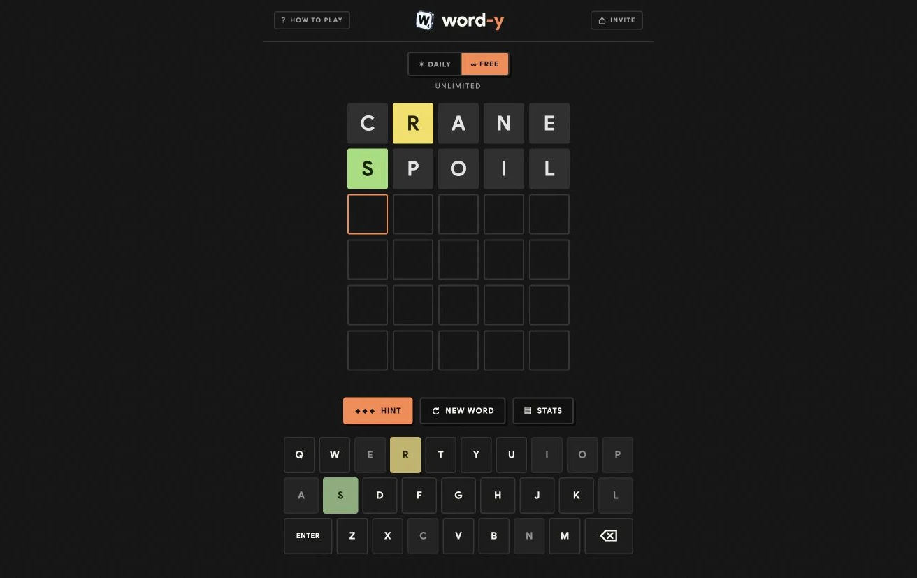 A real word-y round with two guesses, green and gold tile feedback, hints, and an on-screen keyboard